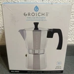Grosche Milano Moka Pot Makes 6 Espresso Cups, 9.3 Oz Silver W/ Black Handle Open. Price: $32.99.