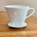 Melitta White Porcelain Pour Over Coffee Filter One Cup 4" Across Bottom New. Price: $24.60.