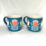 Now Stacking Coffee Mugs Cups Teal White Orange 3D Tulip Flowers - Set 2 Used. Price: $10.00.