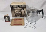 Vtg Pyrex Flameware Cup Deluxe Range Top Percolator 8854 Complete In Box Used. Price: $239.99.